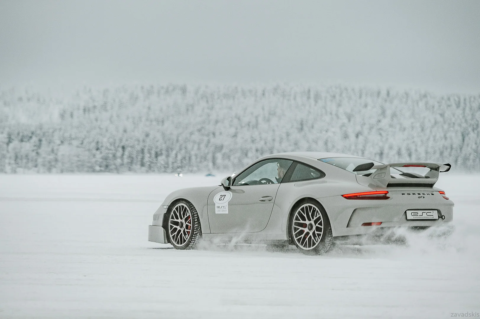 Black Car Driving on a Snowy Surface – Professional Vehicle Photography