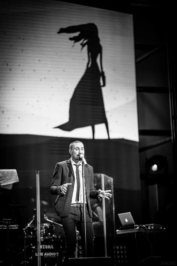 Man in Suit Speaking on Stage – Conference Photography