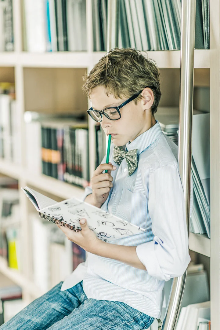 Boy Reading a Book, Arranged in a Home Setting – Children's Photography Portfolio