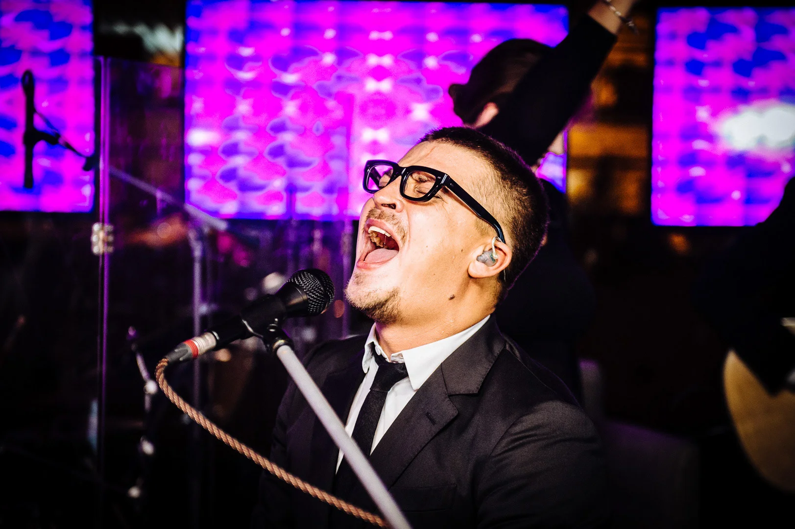 Stage Reportage, Musician with Microphone – Stage Photography