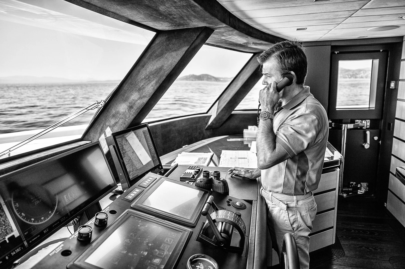 Man Looking Out to Sea From a Ship's Bridge – Travel Photography Portfolio