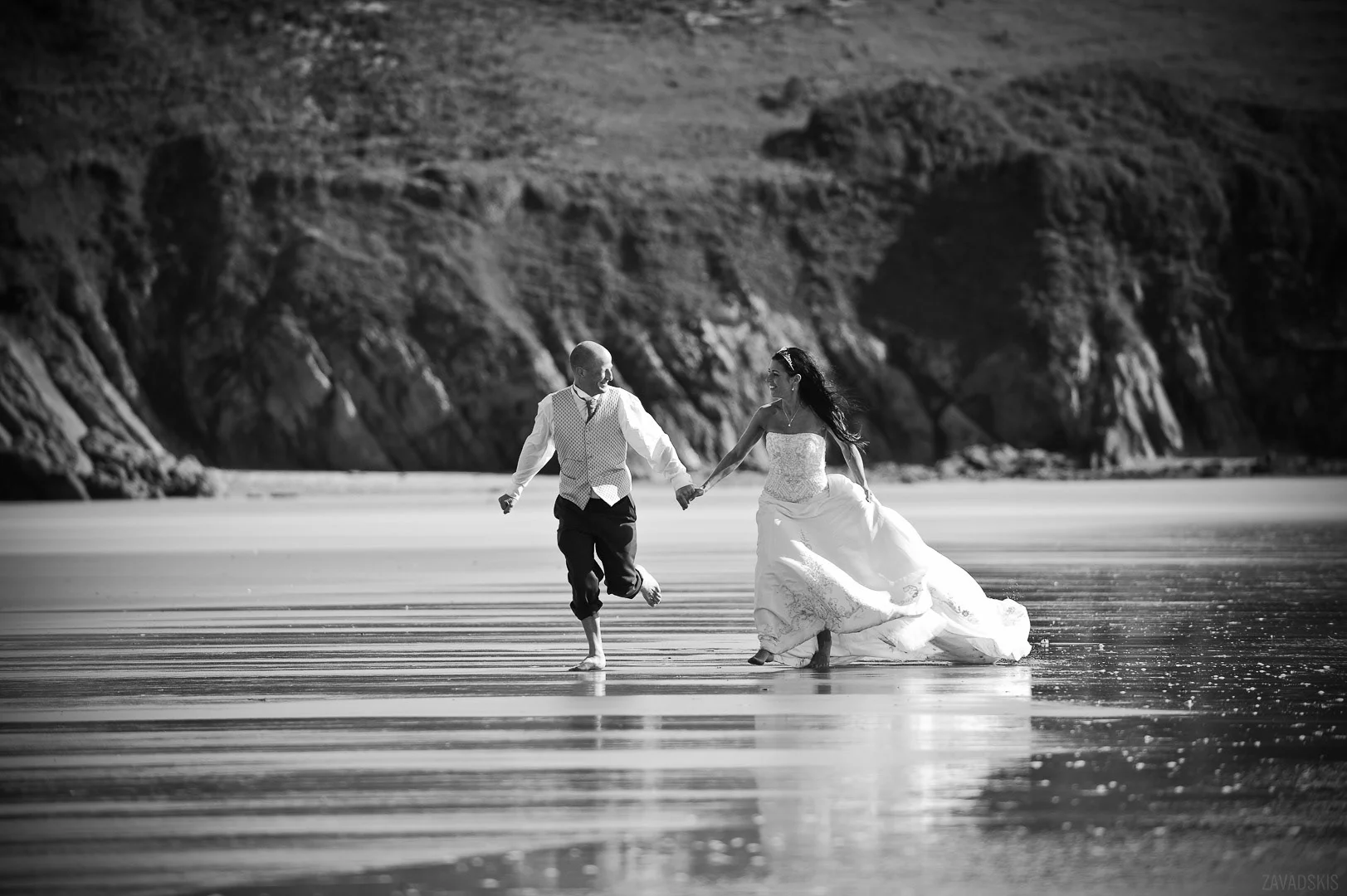Wedding Photograph: Happy Couple Running in Garden – Romantic Wedding Image