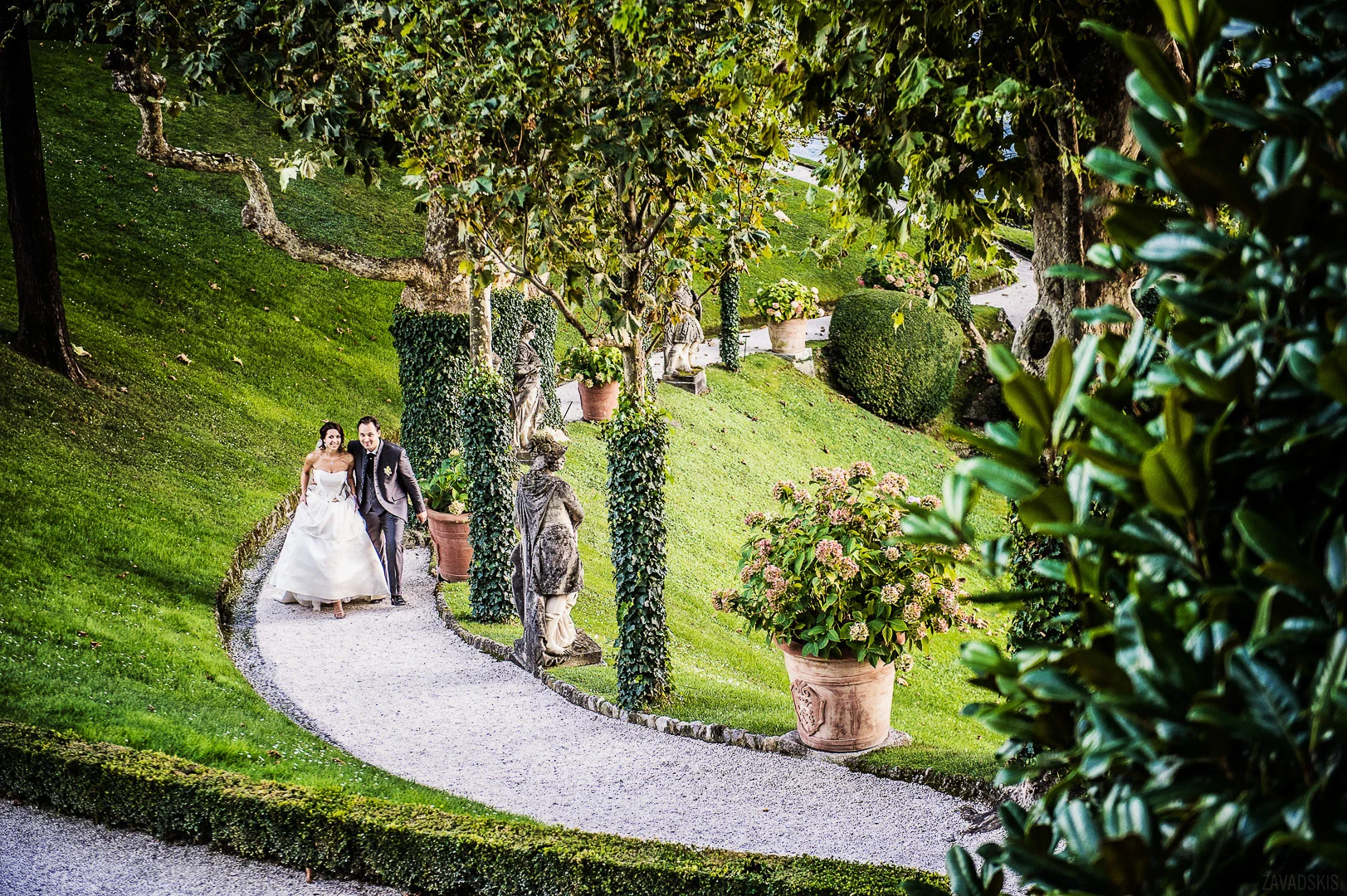 Wedding Photograph: Couple Walking in Garden – Wedding Photography Portfolio